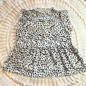 Cream and black high-neck, peplum top